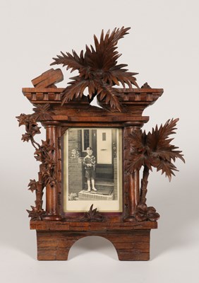 Lot 14 - A CONTEMPORARY CARVED LINDENWOOD BLACK FOREST FRAME
