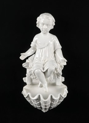 Lot 92 - Porcelain Holy Water Font Depicting the Infant Christ, by Petrus Regout