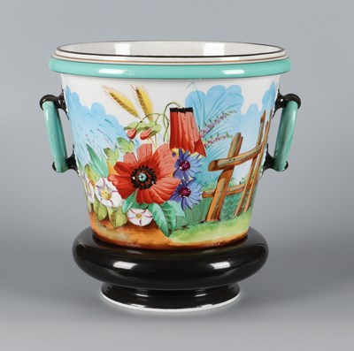 Lot 145 - Tweedelige cachepot met bloemendecor en hekje, Petrus Regout