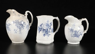Lot 365 - Drie waterkannen met bloemdecors, Petrus Regout
