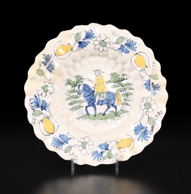 Lot 621 - A Dutch Delft lobed dish or 'Buckelplatte', 18th Century
