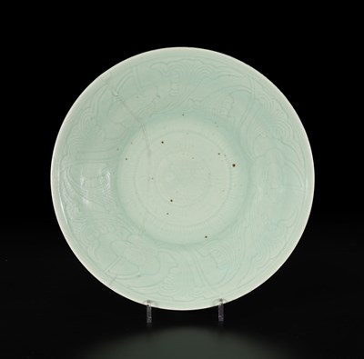 Lot 517 - A Chinese celadon dish with incised floral design