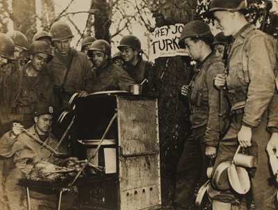 Lot 13 - Robert CAPA (1913-1954) - Thanksgiving Day, 1944