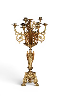 Lot 718 - A gilt ten-light candelabra