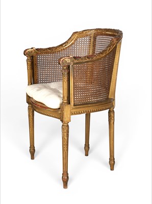 Lot 720 - A Louis XVI style carved giltwood armchair fauteuil de bureau