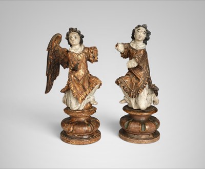 Lot 696 - Pair of giltwood and polychrome genuflecting angel sculptures