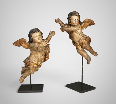 Lot 697 - Pair of polychrome wood putti sculptures