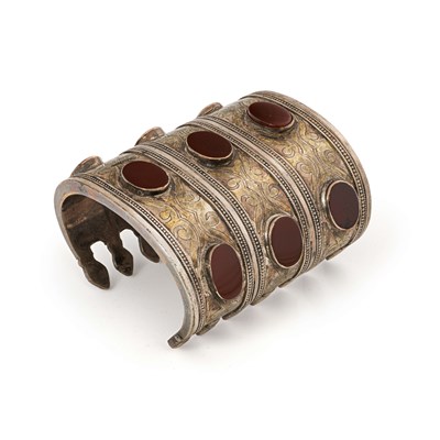 Lot 137 - A Fire-Gilded Silver and Carnelian ‘Bilezik’ Cuff Bracelet.