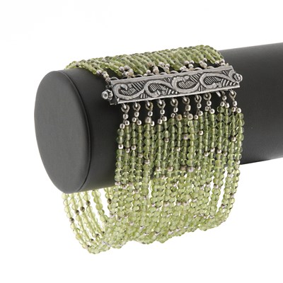 Lot 579 - 20-Strand Peridot Bracelet with Silver Lock