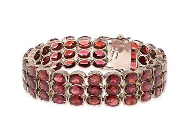 Lot 650 - 3 Rows Silver Eternity Bracelet set with Garnet