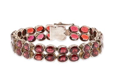 Lot 651 - 2 Rows Silver Eternity Bracelet set with Garnet