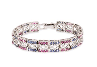 Lot 49 - Silver Eternity Bracelet set with Ruby and Saffire