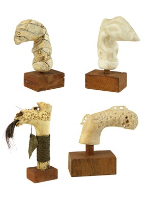 Lot 115 - Four Ivory, Tooth and Bone Kris and Sword Handles.