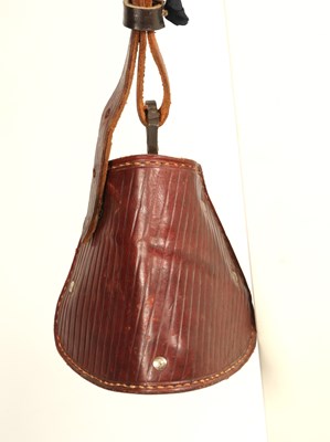 Lot 520 - Early leather saddle with leather and metal stirrups