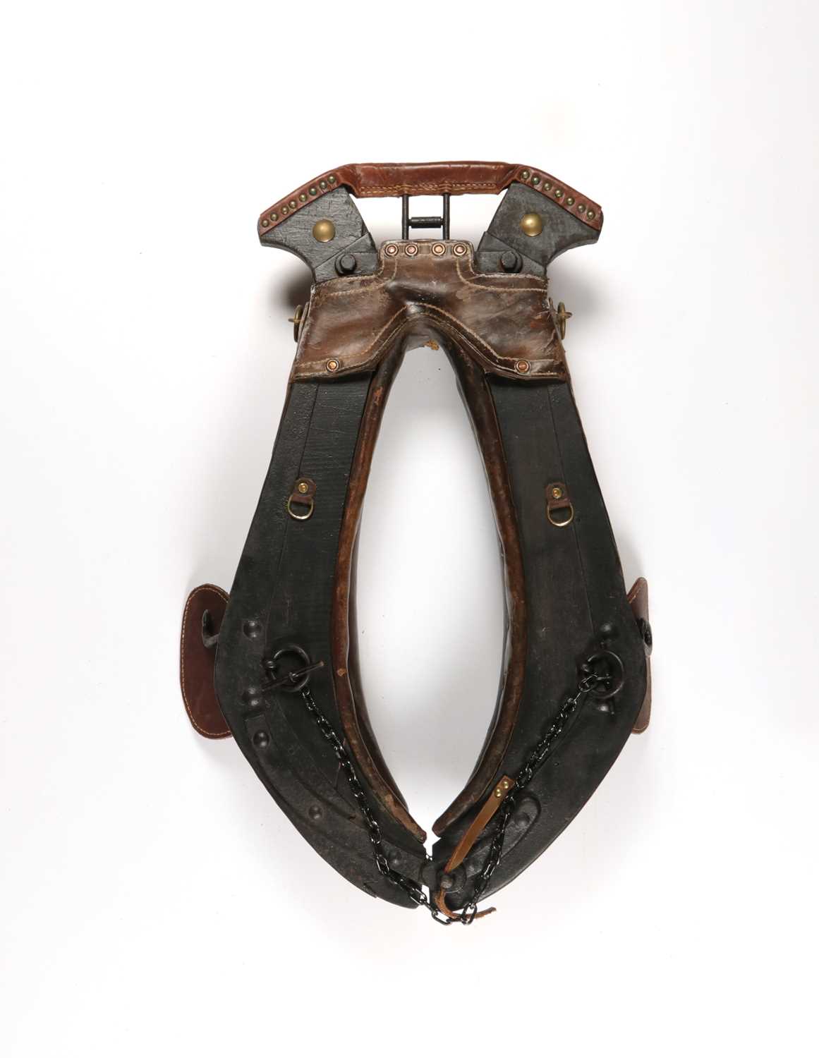 Lot 621 - Antique leather and wood horse collar harness, decorated with studs